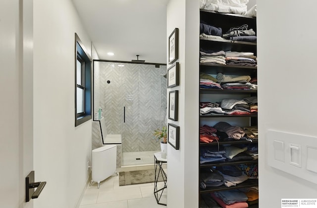 317 N 96th St, Omaha, NE 68114 - bathroom featuring tiled shower, tile patterned floors, and a spacious closet