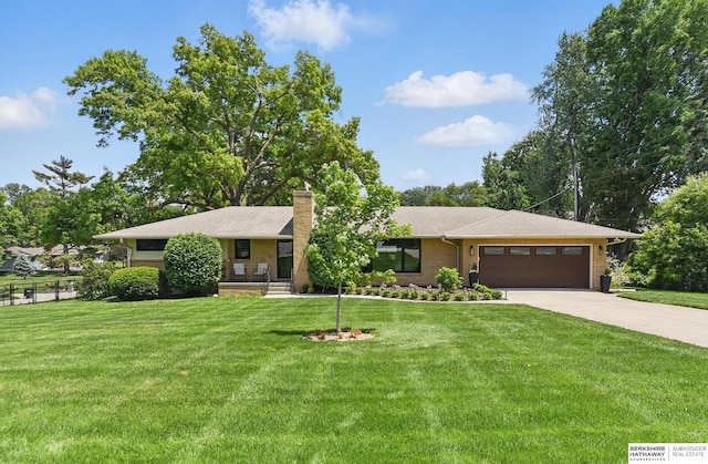 317 N 96th St, Omaha, NE 68114 - ranch-style home with an attached garage, driveway, a chimney, and a front yard