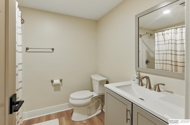 317 N 96th St, Omaha, NE 68114 - full bath with toilet, wood finished floors, vanity, baseboards, and a shower with curtain
