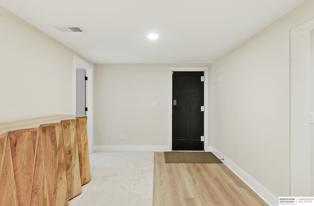 317 N 96th St, Omaha, NE 68114 - foyer entrance with wood finished floors and baseboards
