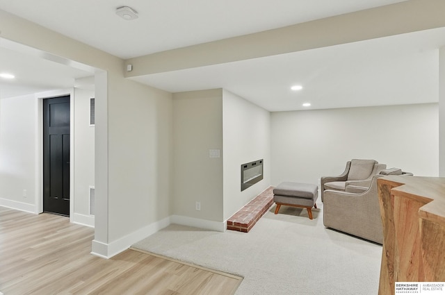 317 N 96th St, Omaha, NE 68114 - living area featuring heating unit, baseboards, a brick fireplace, wood finished floors, and recessed lighting