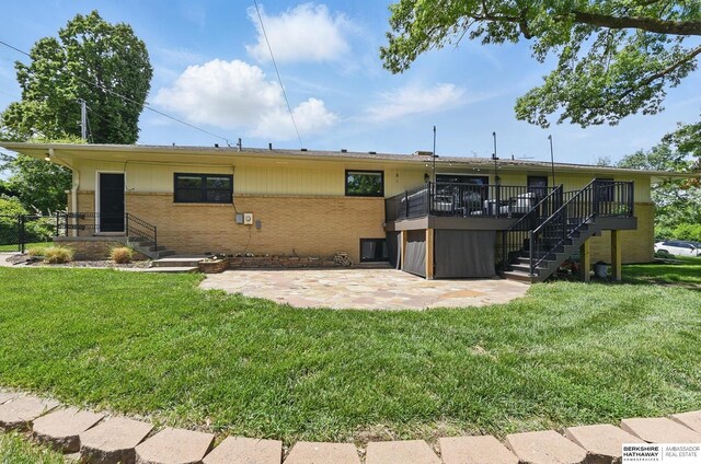 317 N 96th St, Omaha, NE 68114 - rear view of house featuring a patio, brick siding, a yard, and a wooden deck