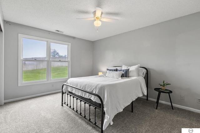 3400 Glenhaven Pl, Lincoln, NE 68506 - carpeted bedroom with a textured ceiling, baseboards, and a ceiling fan