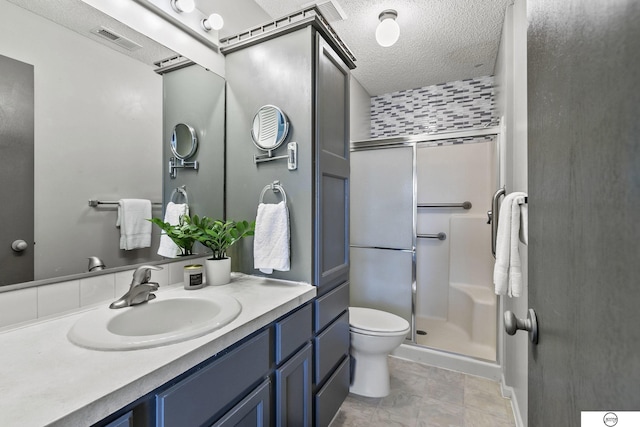3400 Glenhaven Pl, Lincoln, NE 68506 - bathroom featuring toilet, a shower stall, vanity, and a textured ceiling
