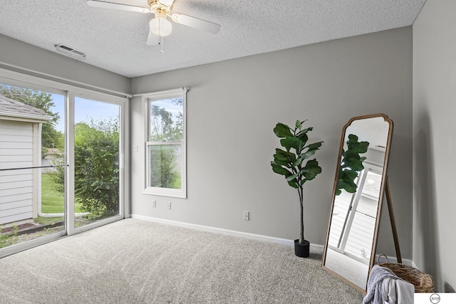 3400 Glenhaven Pl, Lincoln, NE 68506 - unfurnished room with a textured ceiling, carpet, baseboards, and ceiling fan