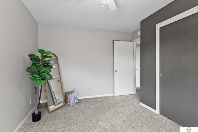 3400 Glenhaven Pl, Lincoln, NE 68506 - unfurnished bedroom featuring carpet floors, a textured ceiling, ceiling fan, and baseboards