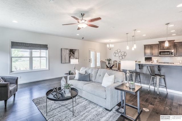 7812 S 196th St, Gretna, NE 68028 - living room with a ceiling fan, dark wood-style flooring, recessed lighting, and a chandelier