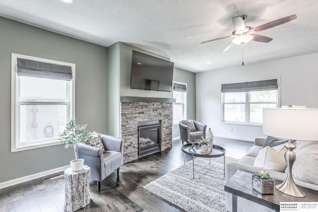 7812 S 196th St, Gretna, NE 68028 - living room with a stone fireplace, a ceiling fan, dark wood finished floors, and recessed lighting