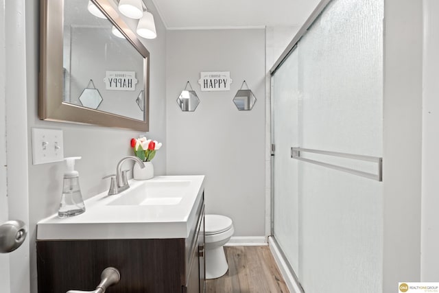 6458 Decatur St, Omaha, NE 68104 - full bath featuring vanity, a shower stall, wood finished floors, and toilet