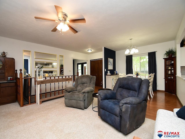 105 Nebraska St, Murdock, NE 68407 - living area with a chandelier, ceiling fan, and wood finished floors