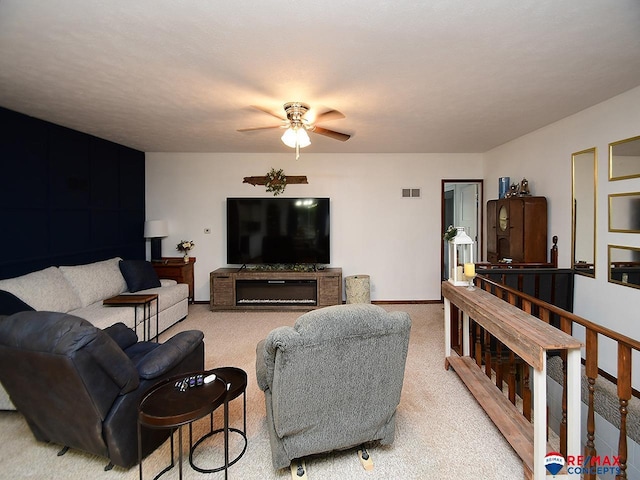 105 Nebraska St, Murdock, NE 68407 - living room with ceiling fan, light carpet, and baseboards
