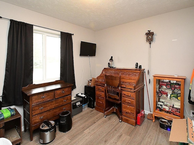 105 Nebraska St, Murdock, NE 68407 - home office featuring light wood-style floors and a textured ceiling