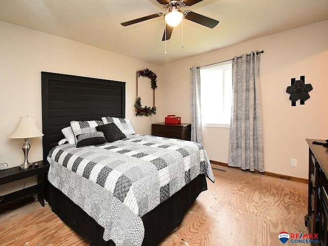 105 Nebraska St, Murdock, NE 68407 - bedroom with light wood-style flooring, baseboards, and a ceiling fan