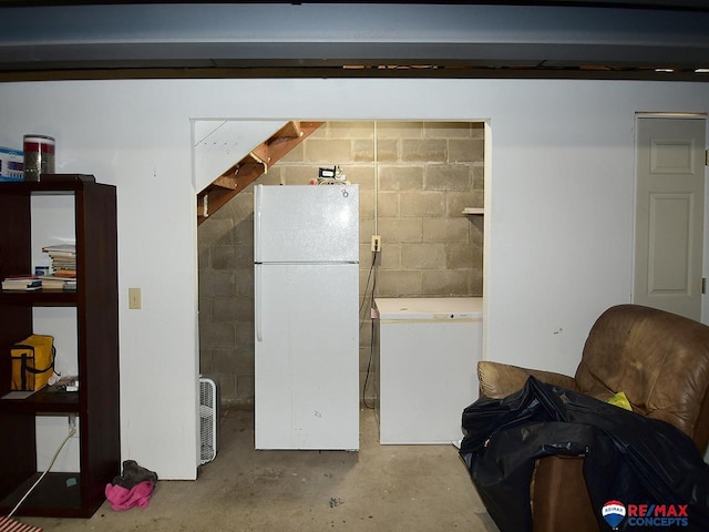 105 Nebraska St, Murdock, NE 68407 - basement featuring freestanding refrigerator, refrigerator, and concrete block wall