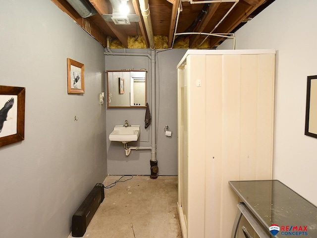 105 Nebraska St, Murdock, NE 68407 - hallway with concrete floors and a sink