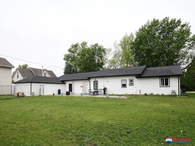 105 Nebraska St, Murdock, NE 68407 - rear view of house featuring a lawn and a patio