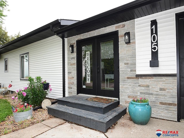 105 Nebraska St, Murdock, NE 68407 - doorway to property with stone siding and french doors