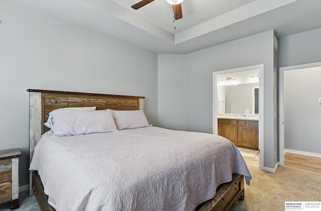 11745 S 113th St, Papillion, NE 68046 - bedroom with light carpet, baseboards, ensuite bathroom, a raised ceiling, and a ceiling fan
