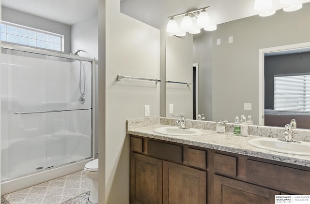 11745 S 113th St, Papillion, NE 68046 - bathroom with double vanity, a shower stall, toilet, and ensuite bathroom