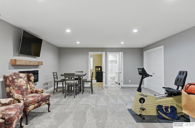 11745 S 113th St, Papillion, NE 68046 - workout room with recessed lighting, a glass covered fireplace, light carpet, and baseboards