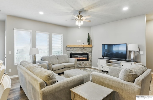 11745 S 113th St, Papillion, NE 68046 - living area with a ceiling fan, dark wood finished floors, baseboards, recessed lighting, and a stone fireplace
