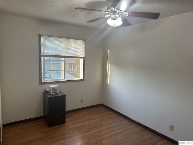 1745 Independence Cir, Lincoln, NE 68521 - unfurnished room with ceiling fan, dark wood-style floors, and baseboards