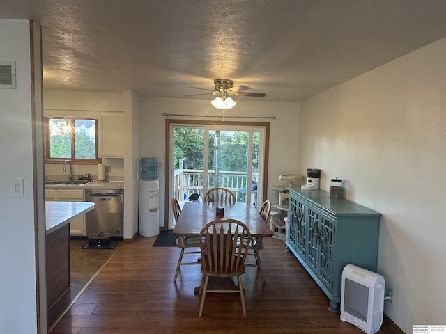 1745 Independence Cir, Lincoln, NE 68521 - dining room featuring dark wood-style floors, a ceiling fan, and a textured ceiling