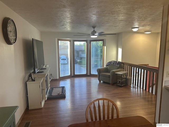 1745 Independence Cir, Lincoln, NE 68521 - living room with a textured ceiling, dark wood finished floors, and a ceiling fan