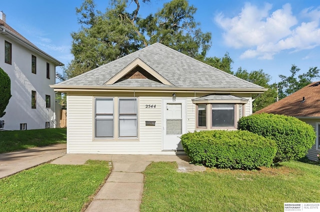 2544 N 64th St, Omaha, NE 68104 - view of front of home featuring a shingled roof and a front yard