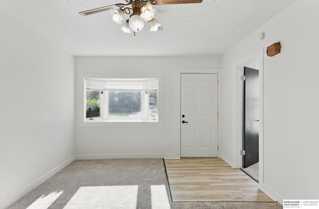2544 N 64th St, Omaha, NE 68104 - entrance foyer featuring a ceiling fan, baseboards, and a textured ceiling