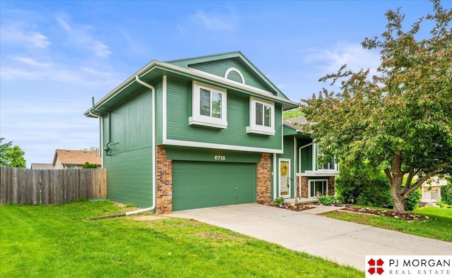 6718 Aspen St, La Vista, NE 68128 - view of front of house featuring brick siding, a garage, and driveway