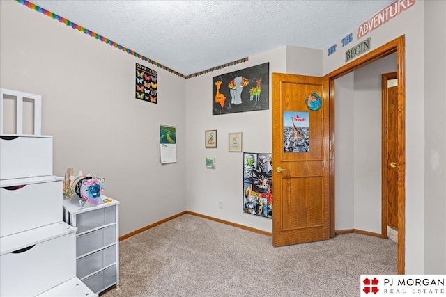 6718 Aspen St, La Vista, NE 68128 - playroom featuring carpet flooring, a textured ceiling, and baseboards