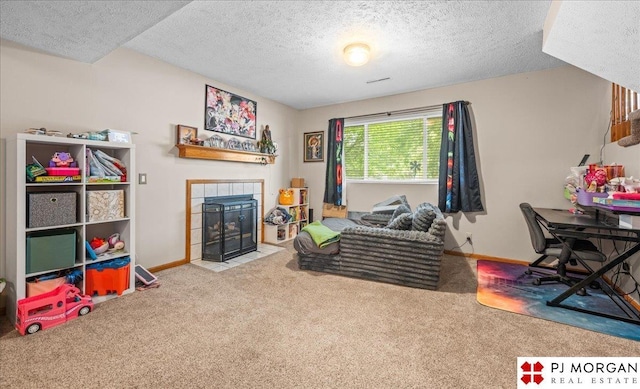 6718 Aspen St, La Vista, NE 68128 - rec room featuring carpet floors, a fireplace, a textured ceiling, and baseboards