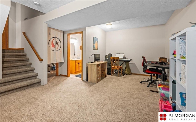 6718 Aspen St, La Vista, NE 68128 - office area with light carpet, a textured ceiling, and baseboards