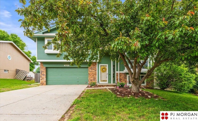 6718 Aspen St, La Vista, NE 68128 - obstructed view of property featuring driveway, brick siding, a garage, and a front yard