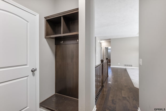 15301 Kansas Ave, Omaha, NE 68116 - mudroom with dark wood finished floors and baseboards