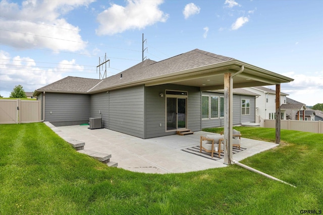 15301 Kansas Ave, Omaha, NE 68116 - rear view of property featuring a gate, a patio area, central AC unit, and roof with shingles