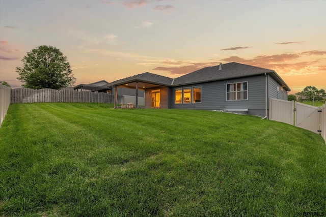 15301 Kansas Ave, Omaha, NE 68116 - back of house at dusk with a gate