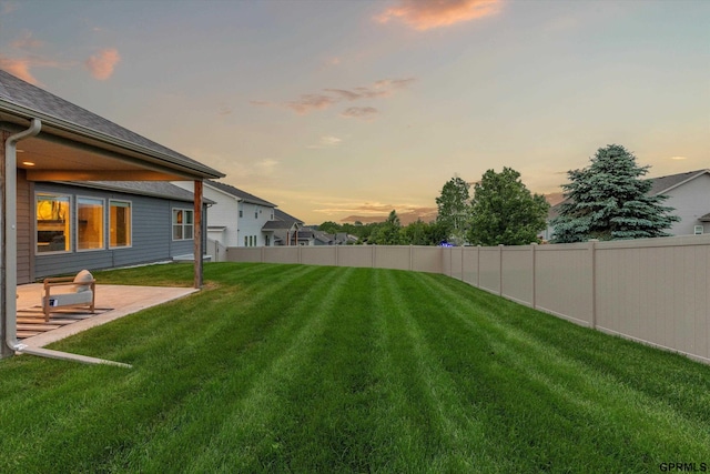 15301 Kansas Ave, Omaha, NE 68116 - yard at dusk featuring a patio area