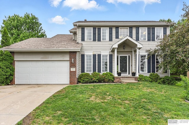 4414 S 174th St, Omaha, NE 68135 - colonial-style house featuring a garage, driveway, brick siding, a front lawn, and a shingled roof
