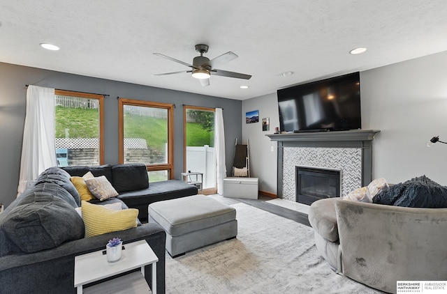 4414 S 174th St, Omaha, NE 68135 - living room with ceiling fan, a fireplace, recessed lighting, wood finished floors, and baseboards