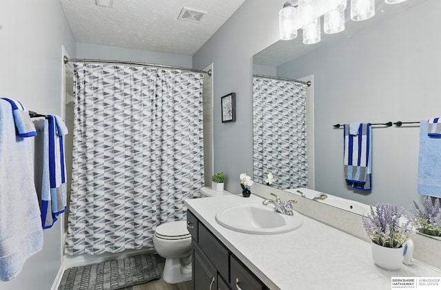 4414 S 174th St, Omaha, NE 68135 - full bathroom with vanity, toilet, a shower with curtain, a textured ceiling, and a chandelier