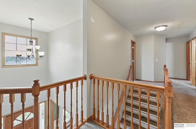 4414 S 174th St, Omaha, NE 68135 - hall featuring carpet, an upstairs landing, a chandelier, and baseboards