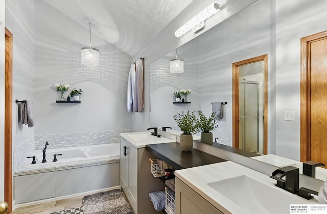 4414 S 174th St, Omaha, NE 68135 - full bath with vanity, a garden tub, a stall shower, and vaulted ceiling