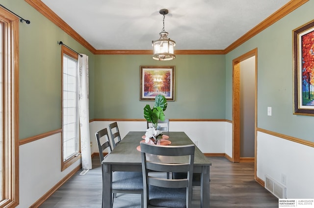 4414 S 174th St, Omaha, NE 68135 - dining room featuring a chandelier, healthy amount of natural light, dark wood-style flooring, and ornamental molding
