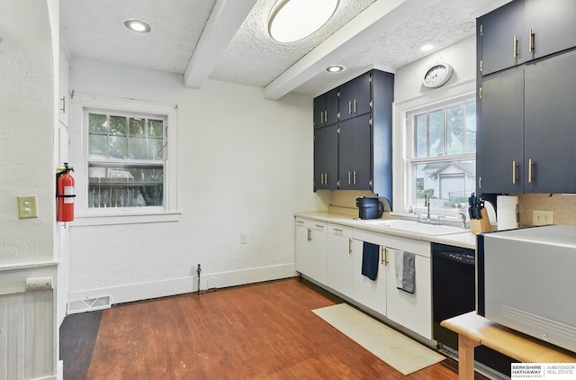 6920 N 30th St, Omaha, NE 68112 - kitchen featuring a sink, beamed ceiling, dark wood-type flooring, black dishwasher, and light countertops