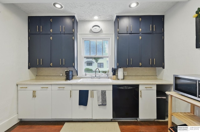 6920 N 30th St, Omaha, NE 68112 - kitchen featuring black dishwasher, stainless steel microwave, a sink, light countertops, and dark wood-type flooring