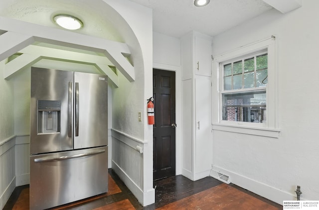 6920 N 30th St, Omaha, NE 68112 - kitchen with stainless steel fridge, dark wood-style flooring, and wainscoting