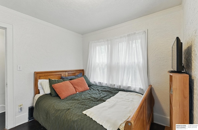 6920 N 30th St, Omaha, NE 68112 - bedroom with crown molding, wood finished floors, and a textured ceiling