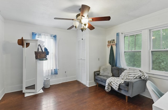 6920 N 30th St, Omaha, NE 68112 - sitting room with wood-type flooring, a ceiling fan, baseboards, and crown molding